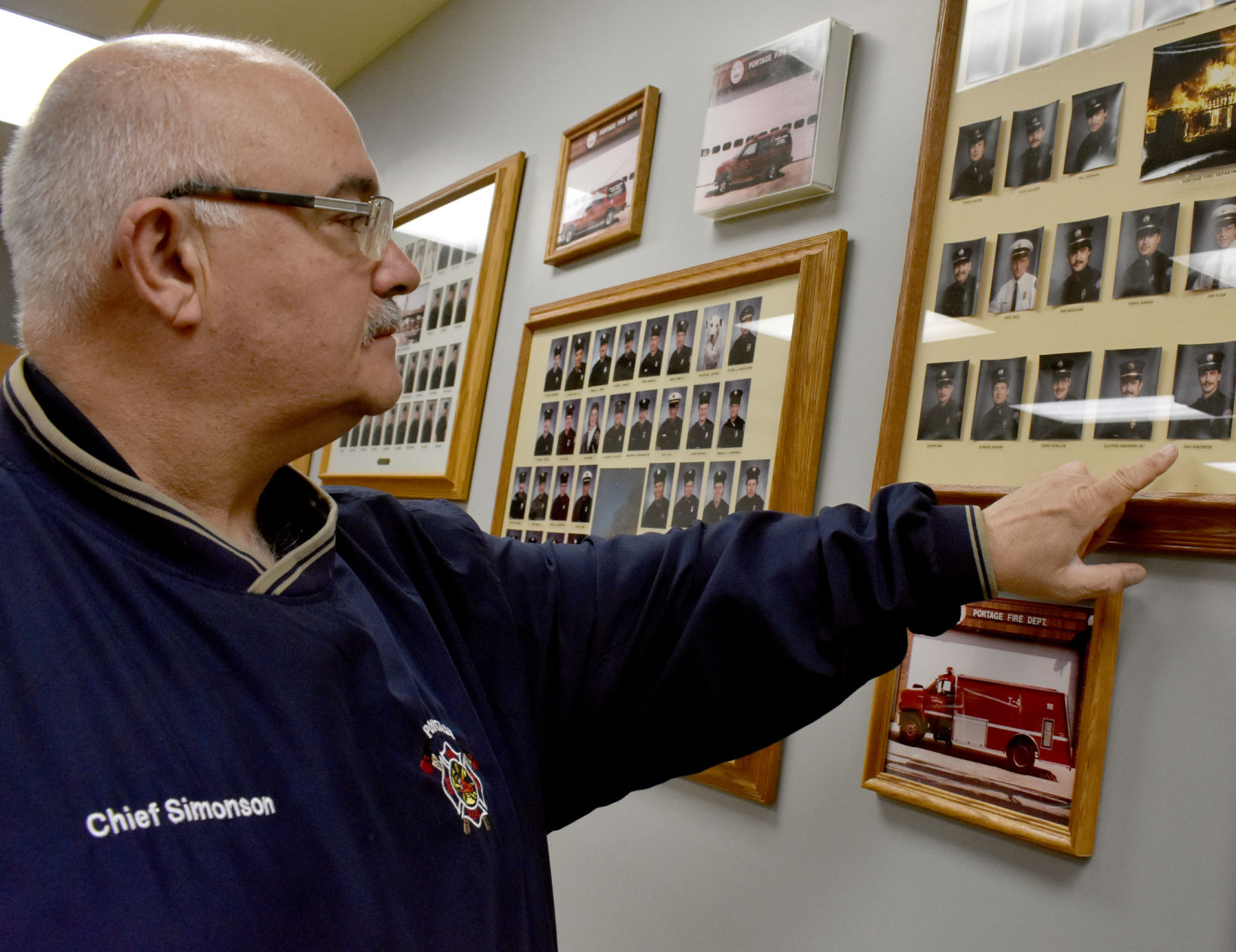 Chief Simonson shows off memorial wall